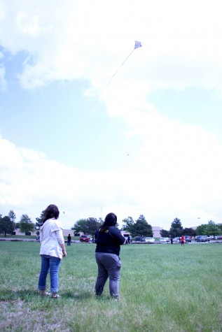 Senior Serena Leyba and freshman Amber Gusse fly a kite together. 