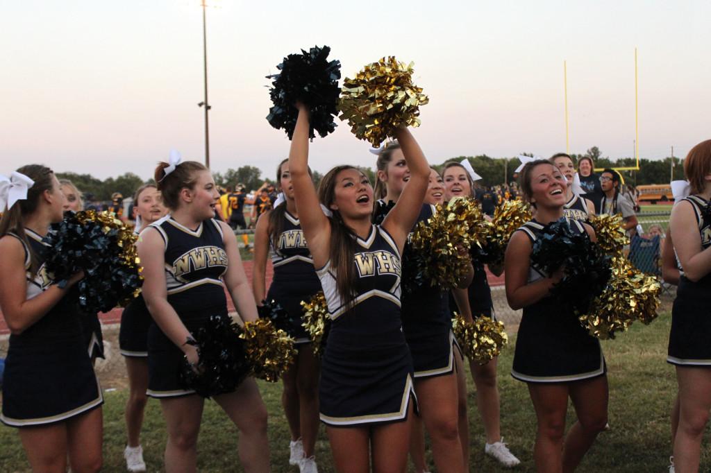 The cheerleaders energize the crowd at Thursday's game.
