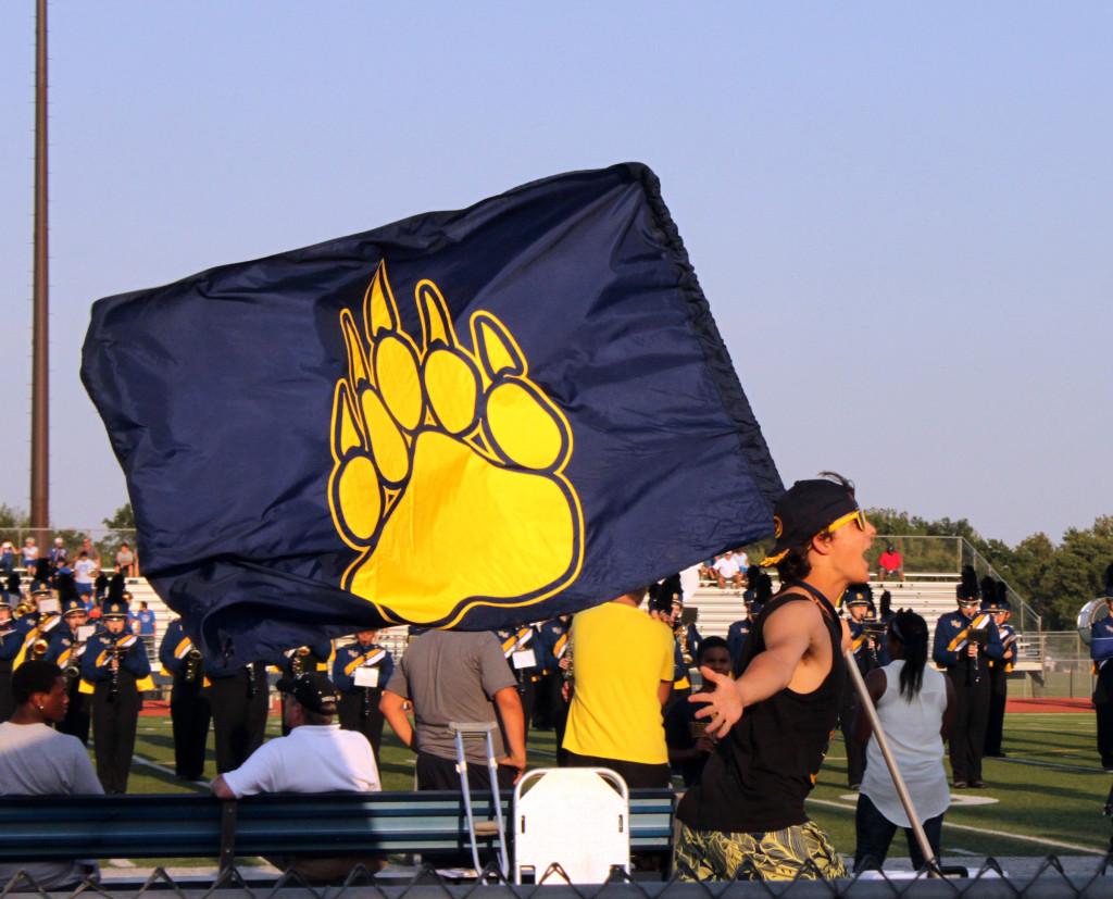 Junior Taylor Jacobson runs with a flag before Thursdays game.