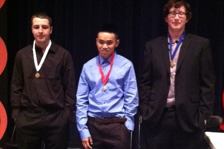 Senior Malcolm Graham poses with fellow DECA members at the end of the competition. 