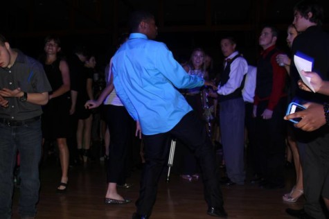 Senior Kole Parker seen dancing in the middle of a group at homecoming