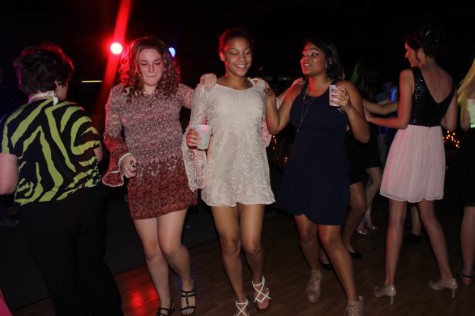 Sophomores Anna Voncannon, Raeanna, Glover, and Sierra Henderson doing a kick line at homecoming.