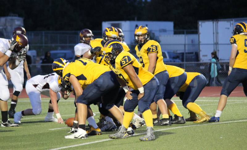 Northwest football team prepares to kick.
