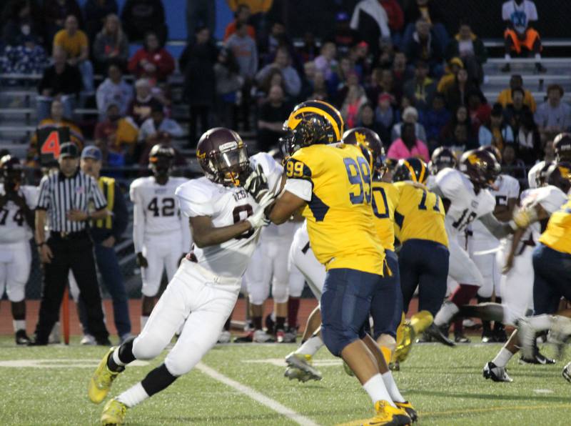 Duall Watson blocks a west player.