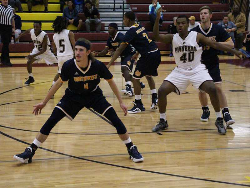 Defense seeks to hold off West during the season opener on Friday, Dec. 4. Photo by Fonseca