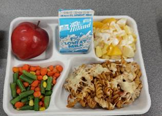 Pasta ragu, vegetable medley and a fruit dish make up the plate prepared by students at the Cooking up Change competition on Dec. 1.