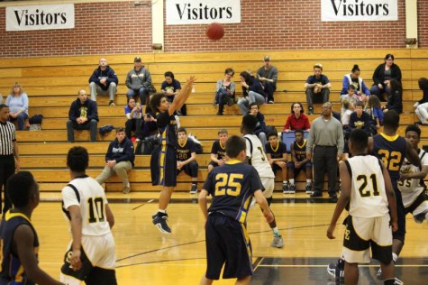 Freshman Kale Patterson shoots 3-pointer in sophomore game.