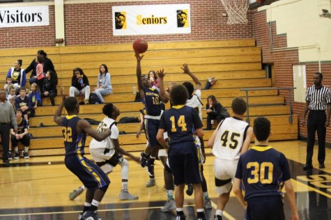 Freshman Roy Johnson goes in for layup against southeast in sophomore game.
