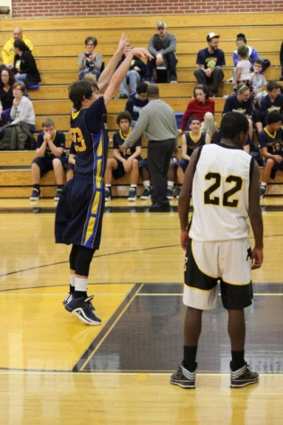 Freshman Timber Allen shoots at the free throw line in the freshman game vs. Southeast.