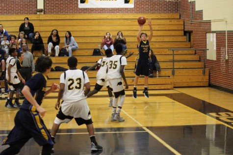 Freshman Logan Anglemyer shoots 3-pointer in sophomore game vs. Southeast.