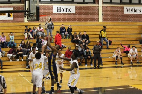 Freshman Percelle FInch shoots a shot from under the basket in the freshman game