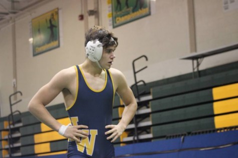Sophomore Austin Anderson worn out during his match.