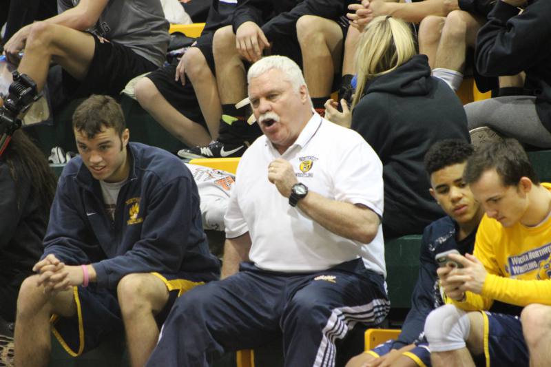 Senior Kevin Folsom, David Nigg, and others supporting the Northwest wrestlers.