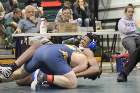 Junior Adam Baker putting the heat on a Junction CIty wrestler.