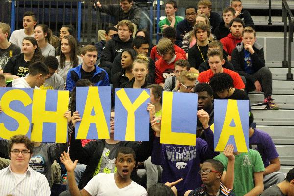 Students spell out Shaylas name out in the crowd.