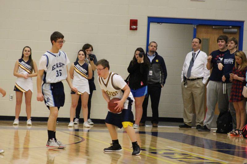 Blake holds onto the ball as he tries to get pass his opponent.