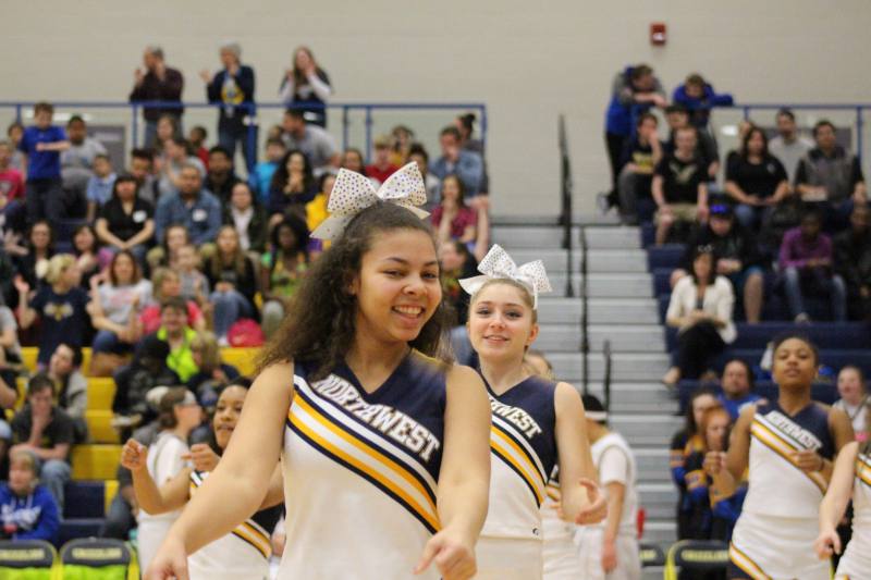 Sophomore Kristiana Blythe cheers during the game.