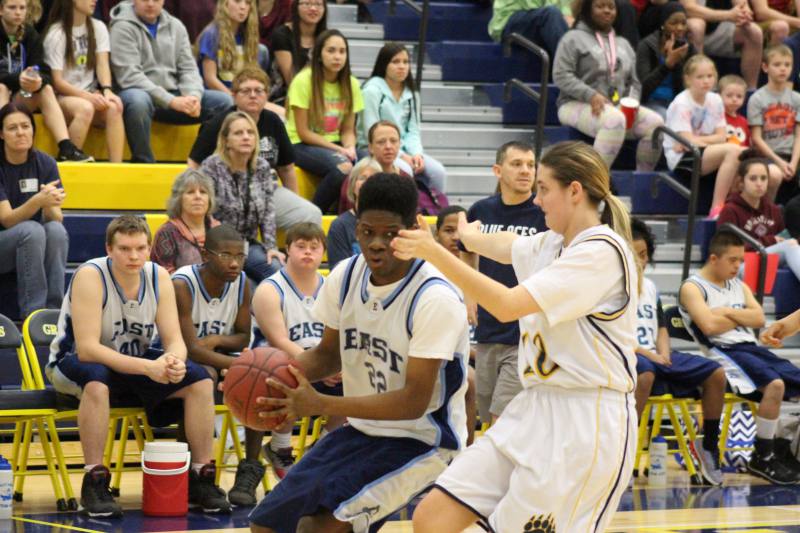 Shayla plays defense against one of the East players.