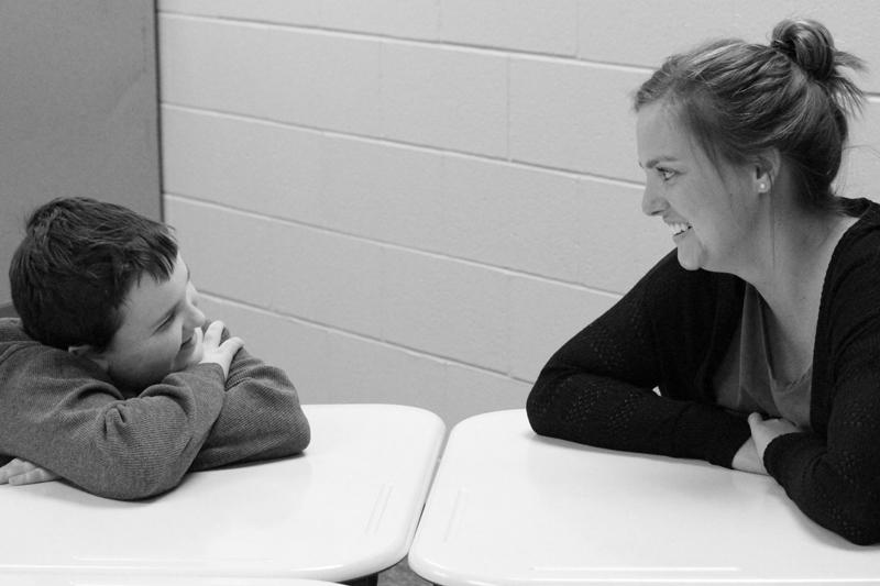 Ashton Latta, son of technology specialist Brian Latta, shares a laugh with Maize South paraprofessional Madeliene Rainbolt. 