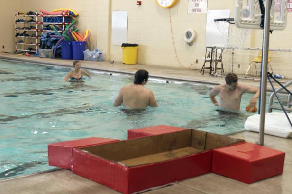 Students enjoy a game of basketball after boat races on May 10