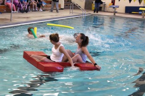 Gabrielle Linn and Ashley Jordan laugh as their classmates sink .