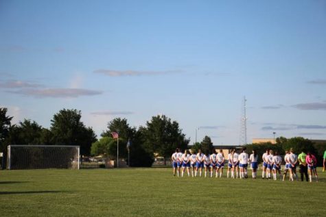 Northwest women's varsity soccer stands in silence, during the national anthem.