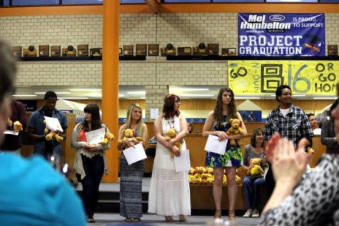 Graduating Seniors hold their bear and certificate at the awards banquet on May 5. Seniors received their bear after completing four years of band or orchestra. 