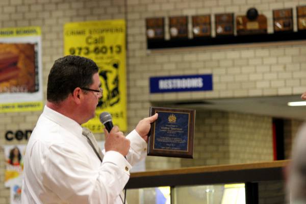 Leopold presents a plaque to Kathy Siemon at the music awards banquet on May 5. Kathy has been the sound support President for two years and is retiring this year.