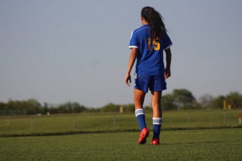Freshman Emmy Rodriguez waits for the next play.