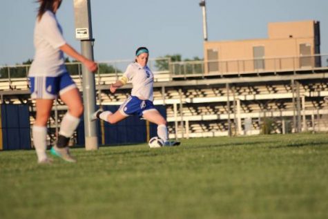 Whitney Weiford (11) hits the ball to team mates