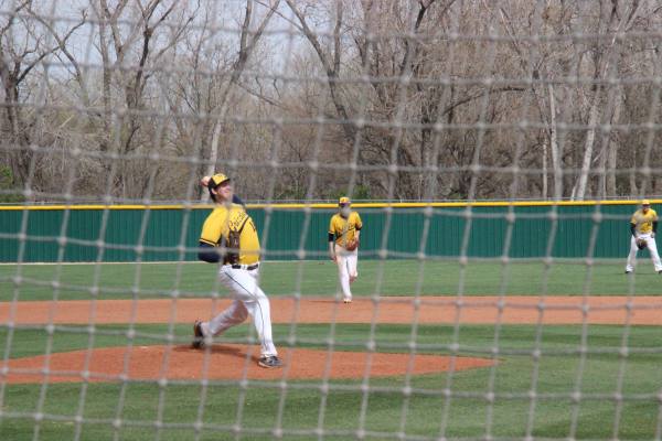 Junior Brady Dingman warms up against Olathe East