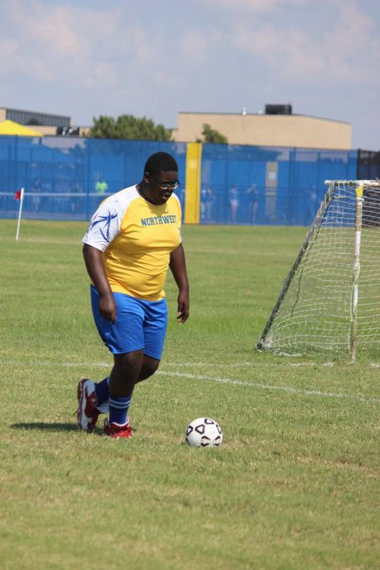 Junior Michael White takes the ball away from the goal. 