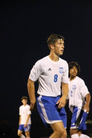 Junior Bryce Harman waiting for the passing of the ball from his other teammate.