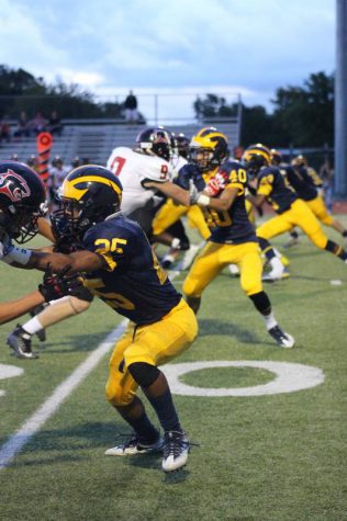 Senior Jorryn Moore and the defensive line up block the opposing team.