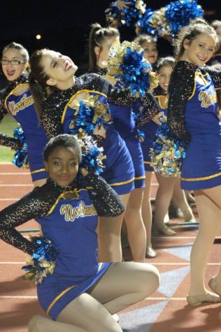 Front row: Bria Tucker (Senior) Back row: Mia Fernandez (Freshman), Tara Dowling (Senior) and Ashlyn Benoit (Sophomore) pose on the track before the half time show.