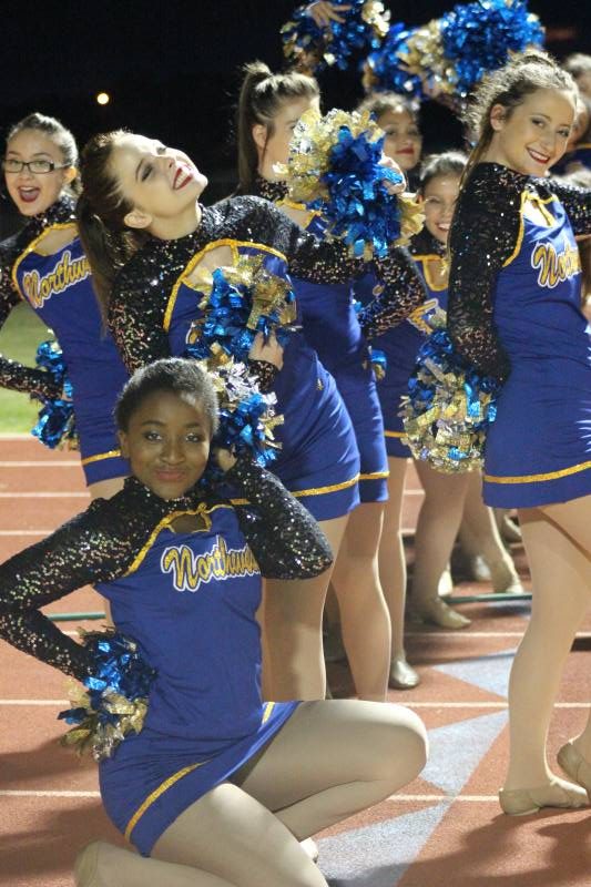 Front row: Bria Tucker (Senior)
Back row: Mia Fernandez (Freshman), Tara Dowling (Senior) and Ashlyn Benoit (Sophomore) pose on the track before the half time show.