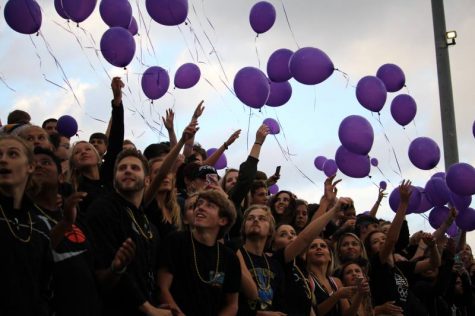 The student section releases purple balloons for Dalton.