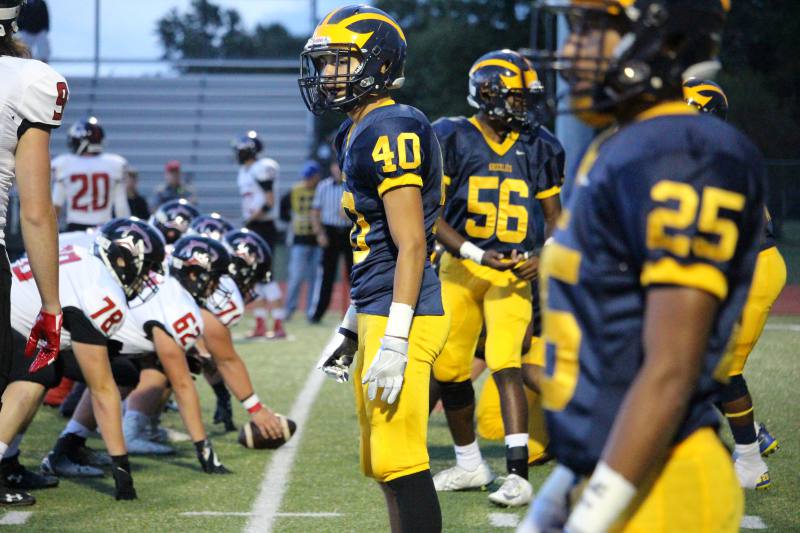 Senior Emilio San Roman looks over to the sidelines.