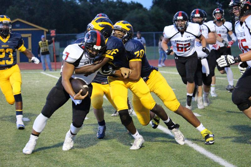 Sophomores Percelle Finch and Marcus Hicks make a double tackle against Great Bend.