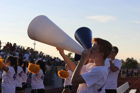 Sophomore Zach Chad chants into the megaphone during the BC game.