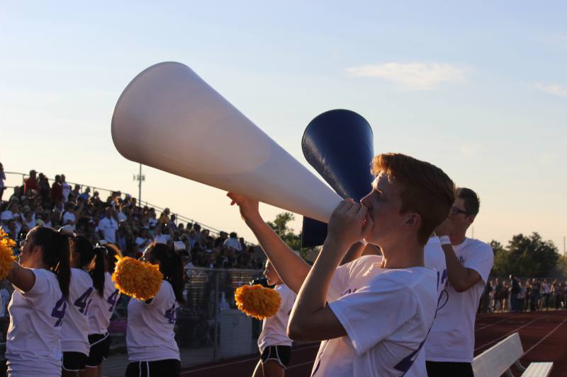 Sophomore Zach Chad chants into the megaphone during the BC game.