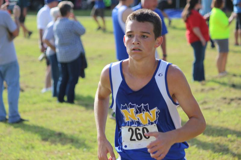 Sophomore Lincoln Phillips runs a 5k in the BC invitational meet.