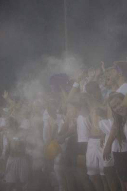 The senior section cheers on the Grizzly football team. 