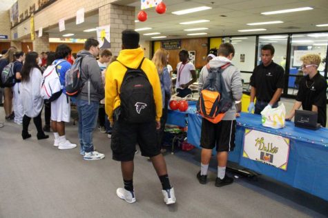 Students waiting in lines to purchase food.