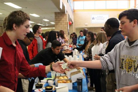 Students buying food from YE businesses.