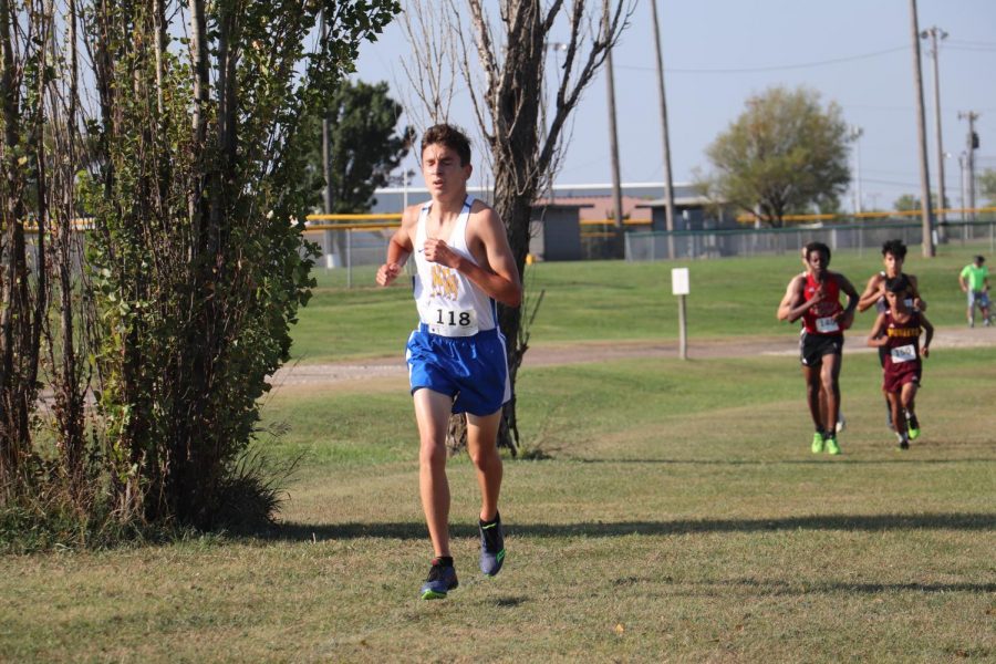 Junior Trey Dafforn settles in to his pace in the early section of the 5k.