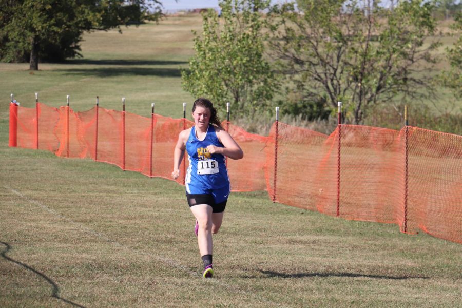 Battling through injuries and the heat, junior Karaleigh Russell approaches the finish line