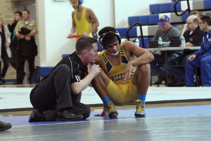 Prichard encourages a wrestler during a meet. 