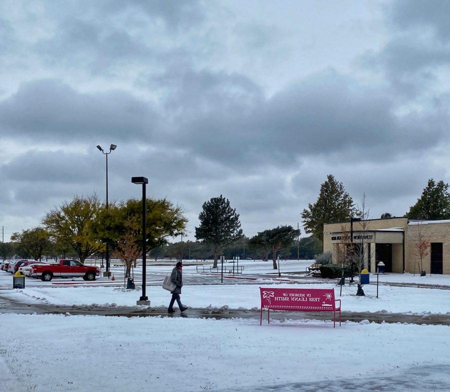 A pedestrian walks towards the Tyler entrance, Monday morning.