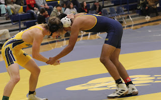 Dalton Clark (12) wrestling Devin Moreno (12).  